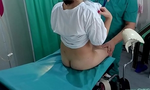 Skirt with pigtails on examination at the gynecologist