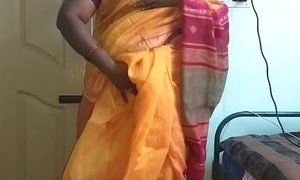 desi  indian horny tamil telugu kannada malayalam hindi cheating wife vanitha wearing orange colour saree  showing big boobs and shaved pussy press immutable boobs press nosh rubbing pussy masturbation