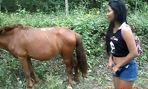 peeing next to horse in jungle